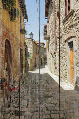 Узкая каменистая улица в Тоскане Борго Монтефиоралле
