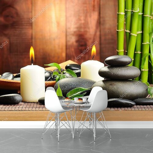 Базальтовые камни и бамбук на столе
