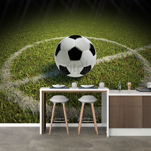 Футбольный мяч в центре поля