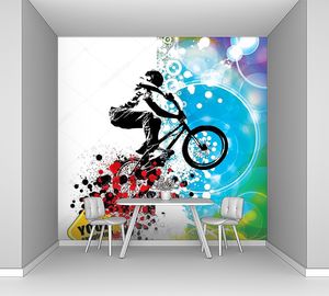 Велосипедист на разноцветном фоне