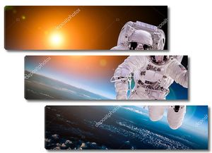 Космонавт в открытом космосе на фоне солнца