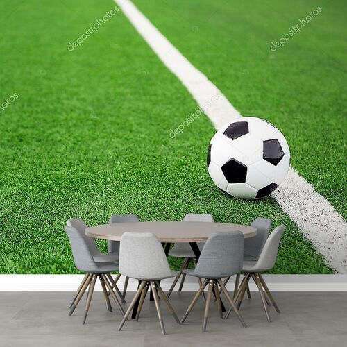 Футбольный мяч на стадионе