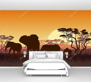 Силуэты диких слонов на фоне заката