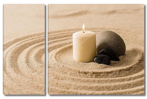 Свеча и камни на песке